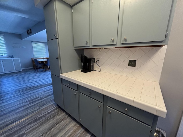 7824 Maple St, Russells Point, OH 43348 - kitchen featuring dark wood-style floors, gray cabinets, tasteful backsplash, and tile countertops