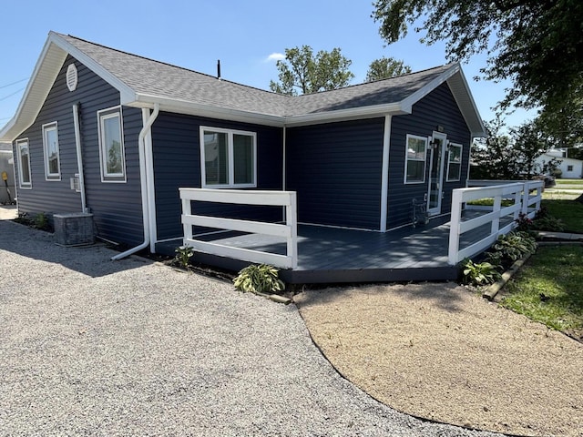 7824 Maple St, Russells Point, OH 43348 - view of side of property featuring a wooden deck and a shingled roof