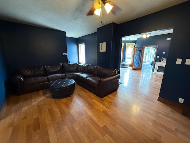612 W Spring St, Saint Marys, OH 45885 - living area with ceiling fan, light wood-style flooring, and a textured ceiling