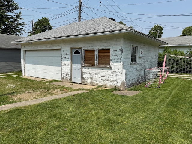 612 W Spring St, Saint Marys, OH 45885 - view of front of property with a shingled roof, brick siding, a garage, and a front lawn