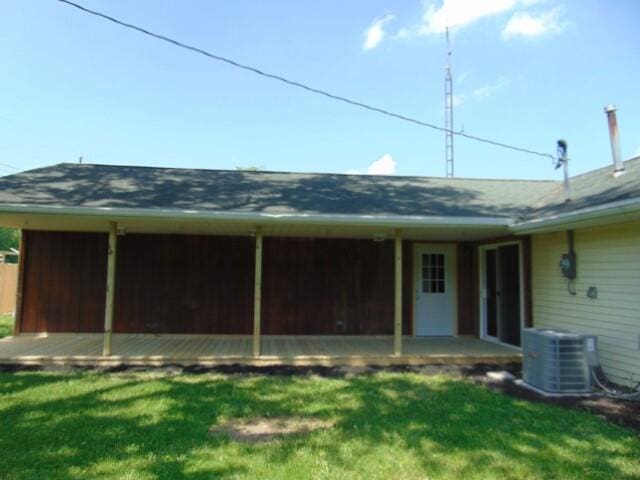 1723 Bermuda Dr, Lima, OH 45801 - back of property with a yard, central AC, and a sunroom