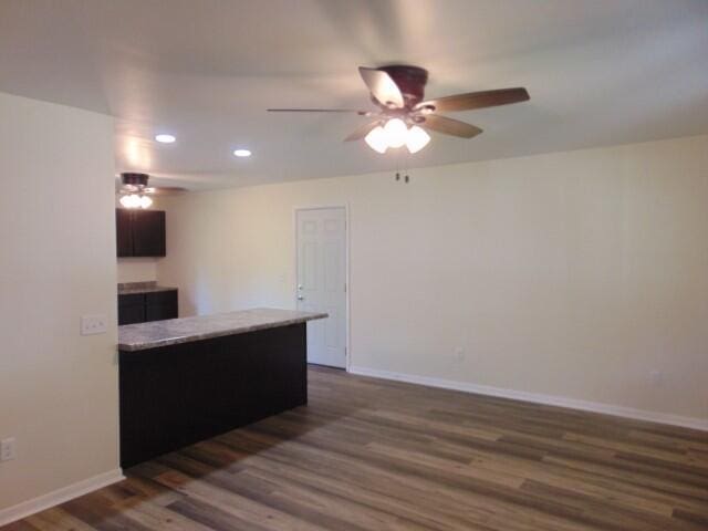 1723 Bermuda Dr, Lima, OH 45801 - kitchen with ceiling fan, dark wood-style flooring, recessed lighting, baseboards, and light countertops