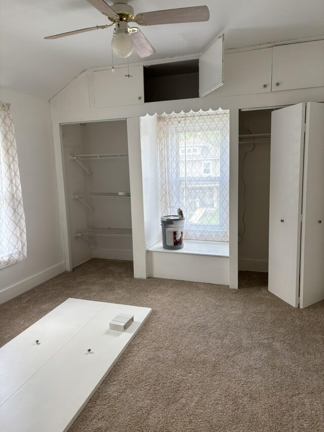 320 N Clairmont Ave, Springfield, OH 45503 - unfurnished bedroom with carpet floors, two closets, and ceiling fan