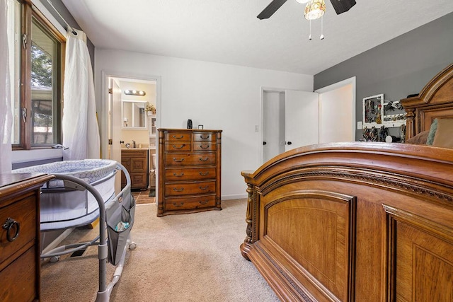 930 N Bickett Rd, Xenia, OH 45385 - bedroom featuring light colored carpet, ensuite bath, and ceiling fan