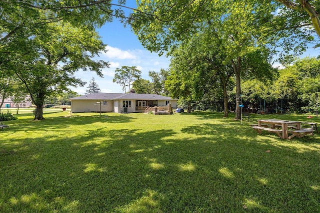 930 N Bickett Rd, Xenia, OH 45385 - view of green lawn featuring a wooden deck