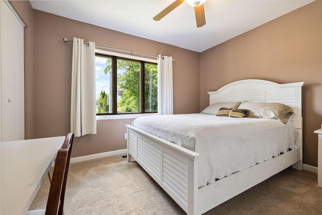 930 N Bickett Rd, Xenia, OH 45385 - bedroom with light colored carpet and a ceiling fan