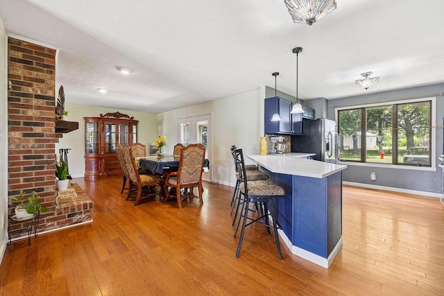 930 N Bickett Rd, Xenia, OH 45385 - kitchen featuring stainless steel fridge, healthy amount of natural light, and light wood-style flooring