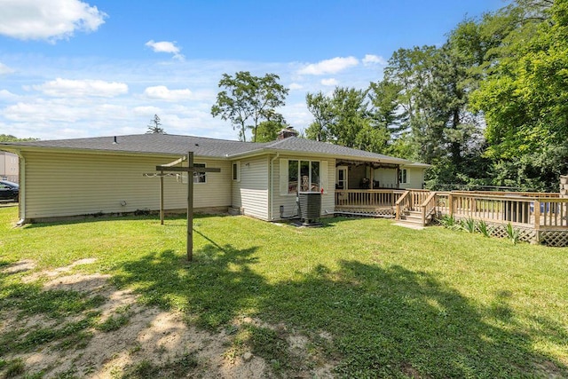 930 N Bickett Rd, Xenia, OH 45385 - back of house featuring a deck, a lawn, and a chimney