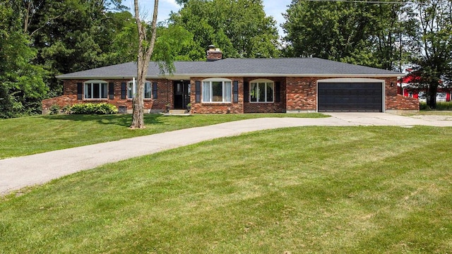 930 N Bickett Rd, Xenia, OH 45385 - ranch-style house featuring brick siding, an attached garage, a front lawn, a chimney, and concrete driveway