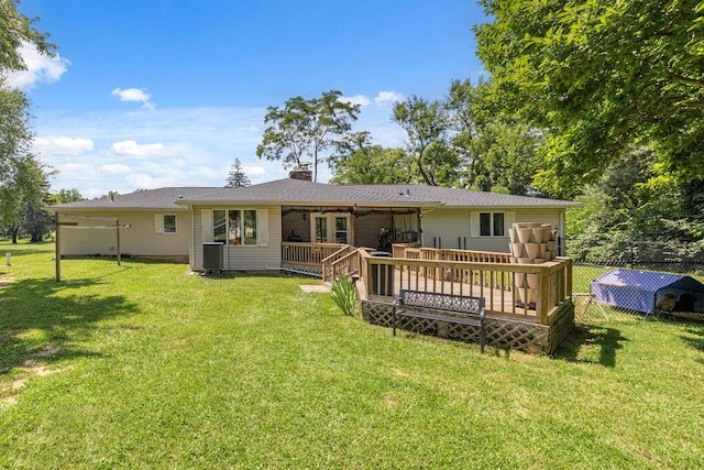 930 N Bickett Rd, Xenia, OH 45385 - back of property featuring a wooden deck and a chimney