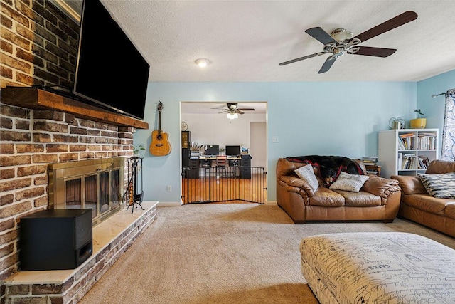 930 N Bickett Rd, Xenia, OH 45385 - living room with light carpet, a ceiling fan, a fireplace, and a textured ceiling