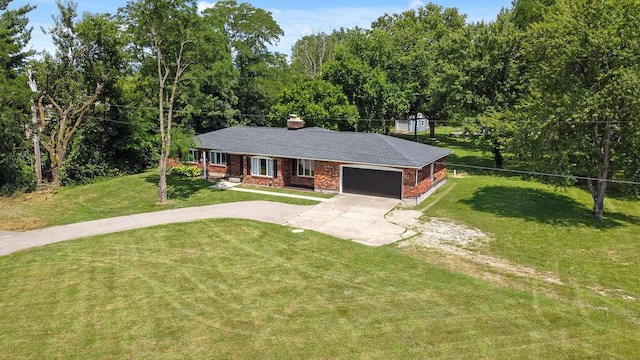 930 N Bickett Rd, Xenia, OH 45385 - ranch-style home featuring an attached garage, driveway, a front lawn, and brick siding