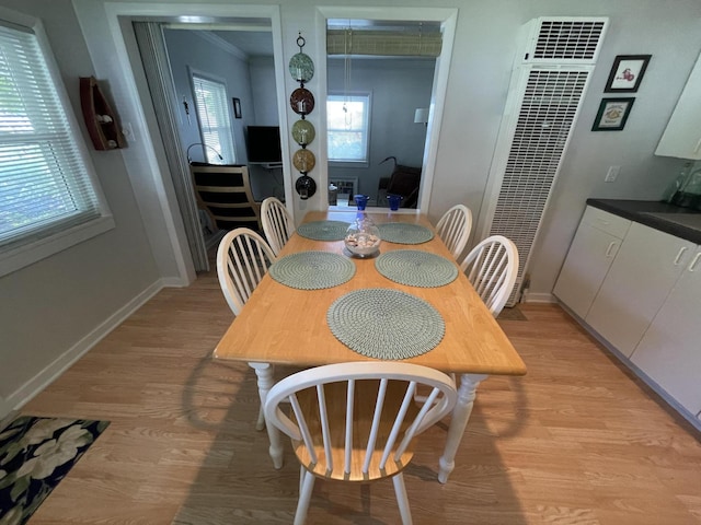 dining space with light wood-type flooring