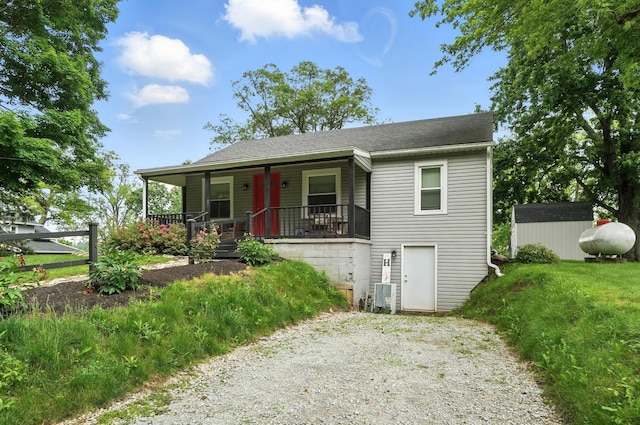 5638 Old Rte 70, Springfield, OH 45502 - view of front facade featuring a porch, a shed, and a shingled roof