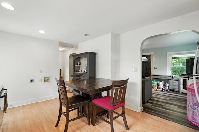 5638 Old Rte 70, Springfield, OH 45502 - dining space with arched walkways, light wood-style floors, and recessed lighting