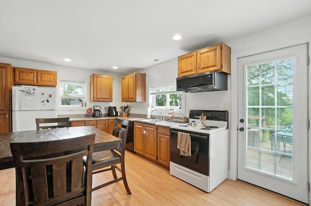 5638 Old Rte 70, Springfield, OH 45502 - kitchen with white appliances, light wood-style flooring, light countertops, and recessed lighting