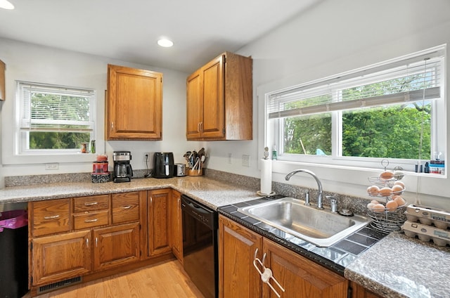 5638 Old Rte 70, Springfield, OH 45502 - kitchen featuring dishwashing machine, healthy amount of natural light, light wood-style flooring, brown cabinets, and recessed lighting