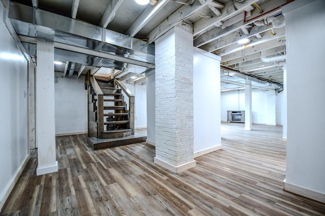 basement with wood-type flooring