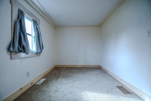 unfurnished room with carpet flooring