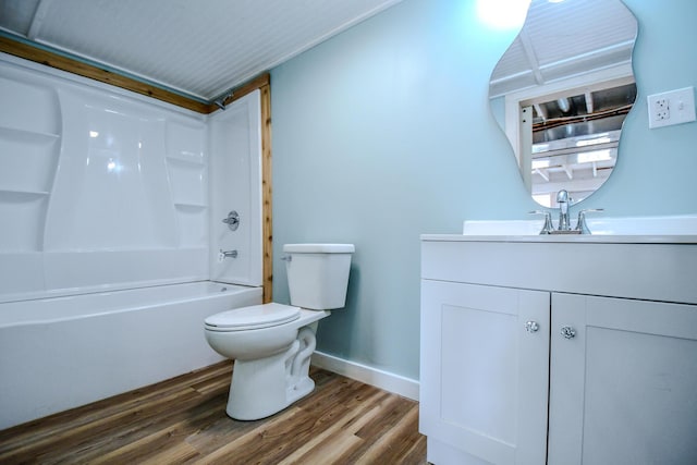 full bathroom featuring hardwood / wood-style flooring, vanity, bathtub / shower combination, and toilet