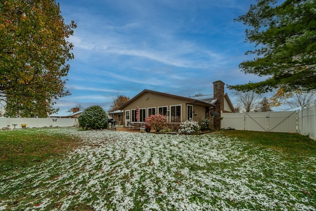 back of house with a yard