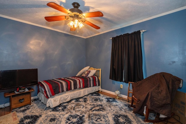 bedroom featuring hardwood / wood-style flooring, ornamental molding, a textured ceiling, and ceiling fan