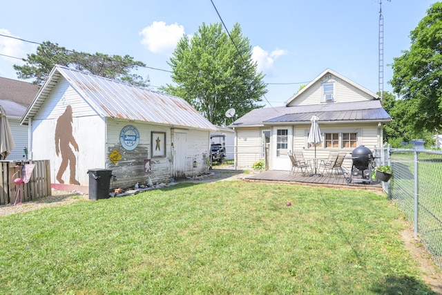 208 E Main St, Belle Center, OH 43310 - back of house featuring a fenced backyard, a metal roof, and a wooden deck