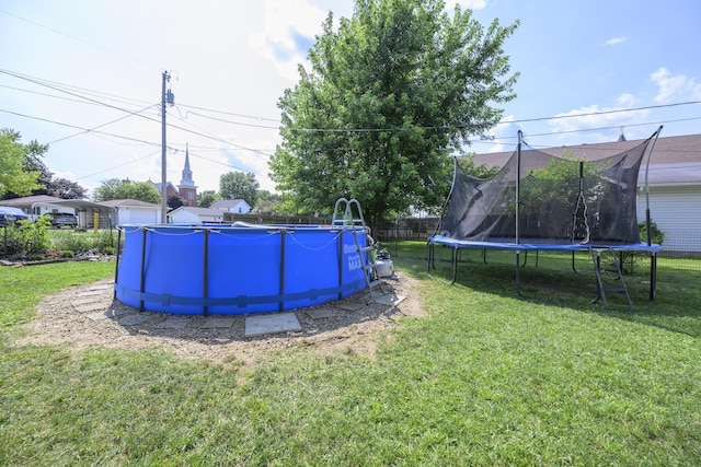 208 E Main St, Belle Center, OH 43310 - view of yard featuring a trampoline