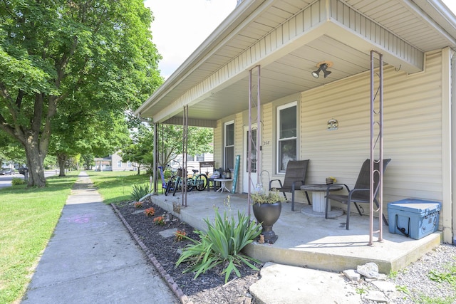 208 E Main St, Belle Center, OH 43310 - porch featuring a lawn