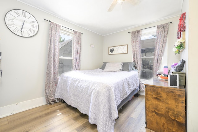 208 E Main St, Belle Center, OH 43310 - bedroom with ornamental molding, wood finished floors, and ceiling fan