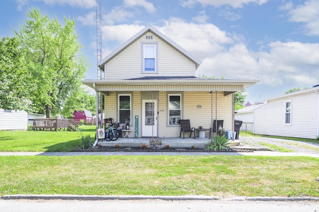 208 E Main St, Belle Center, OH 43310 - bungalow-style house featuring covered porch and a front yard