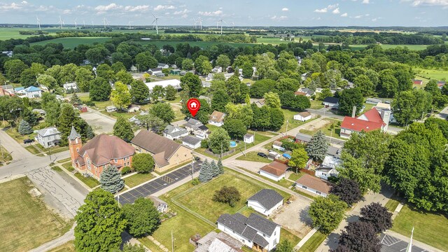 208 E Main St, Belle Center, OH 43310 - aerial view of residential area featuring a tree filled landscape