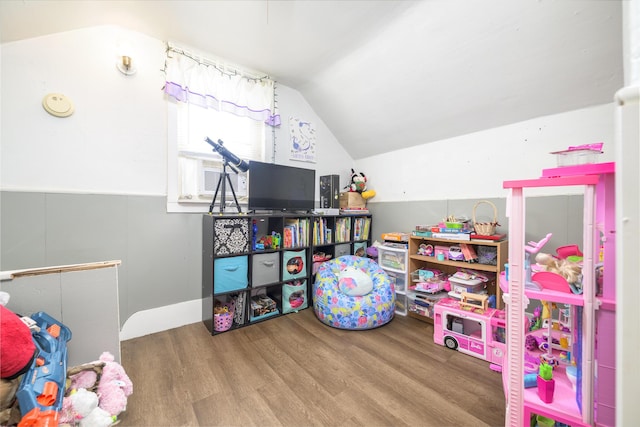 208 E Main St, Belle Center, OH 43310 - playroom featuring wood finished floors, vaulted ceiling, and cooling unit