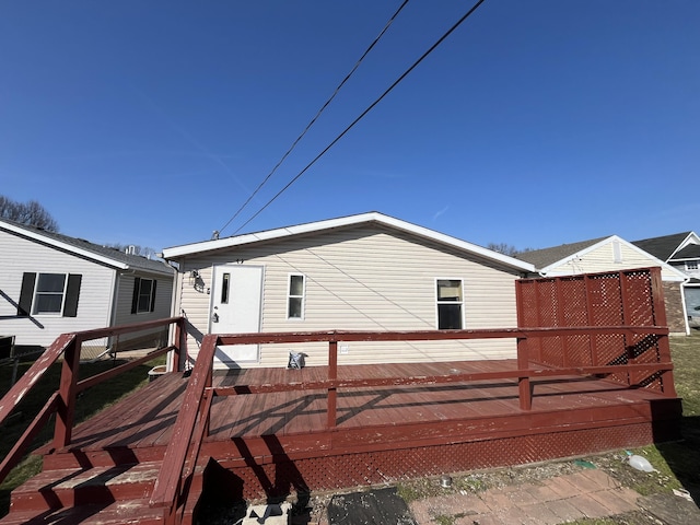 view of side of home with a wooden deck