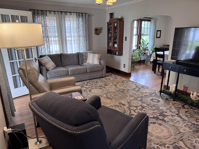 607 W S St, Saint Marys, OH 45885 - living area featuring arched walkways, wood finished floors, ornamental molding, and baseboards