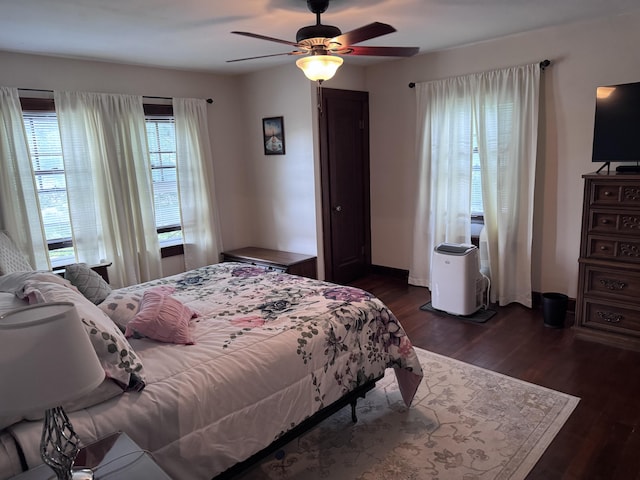 607 W S St, Saint Marys, OH 45885 - bedroom featuring dark wood-style floors, a ceiling fan, and baseboards
