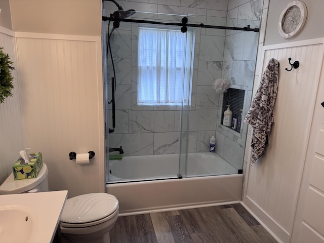607 W S St, Saint Marys, OH 45885 - full bathroom featuring vanity, wood finished floors, toilet, and combined bath / shower with glass door