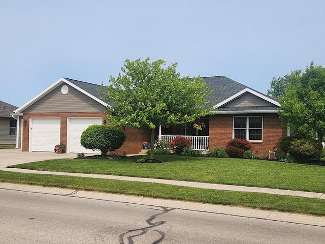 1206 Kimberly Dr, Saint Marys, OH 45885 - single story home featuring brick siding, a front lawn, driveway, and a garage