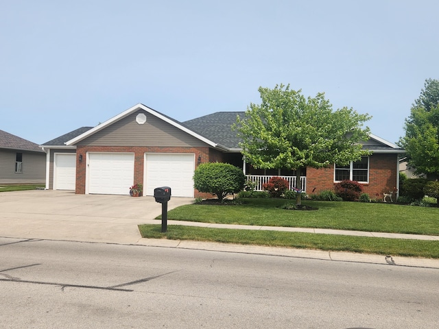 1206 Kimberly Dr, Saint Marys, OH 45885 - ranch-style house with brick siding, an attached garage, a front yard, and concrete driveway