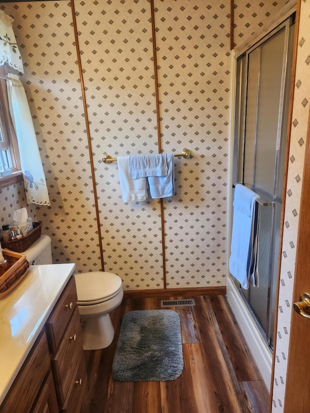 1206 Kimberly Dr, Saint Marys, OH 45885 - bathroom featuring wood finished floors, toilet, vanity, and a shower stall