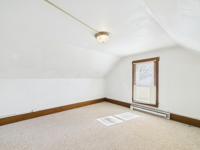 249 W Washington St, New Madison, OH 45346 - bonus room featuring baseboards, lofted ceiling, carpet floors, and a baseboard radiator