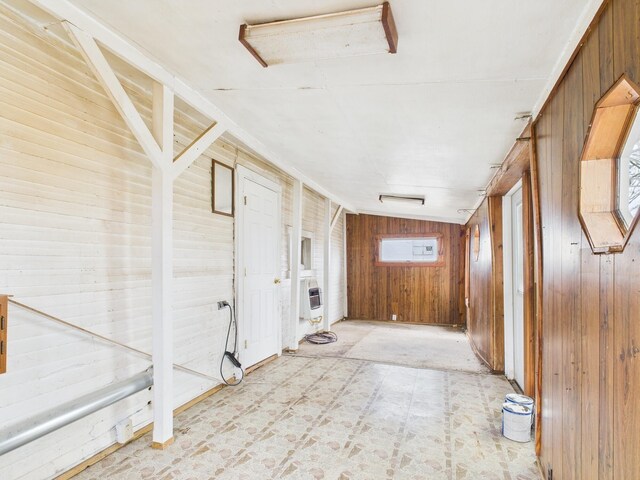 249 W Washington St, New Madison, OH 45346 - corridor featuring heating unit, wood walls, and light floors