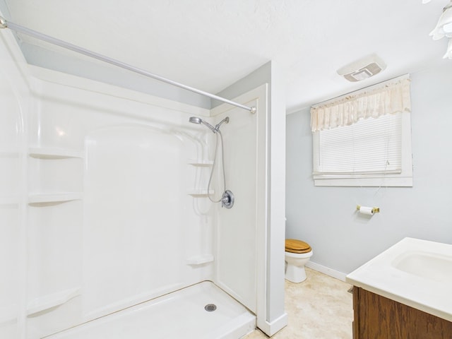 249 W Washington St, New Madison, OH 45346 - full bath featuring toilet, vanity, walk in shower, baseboards, and visible vents