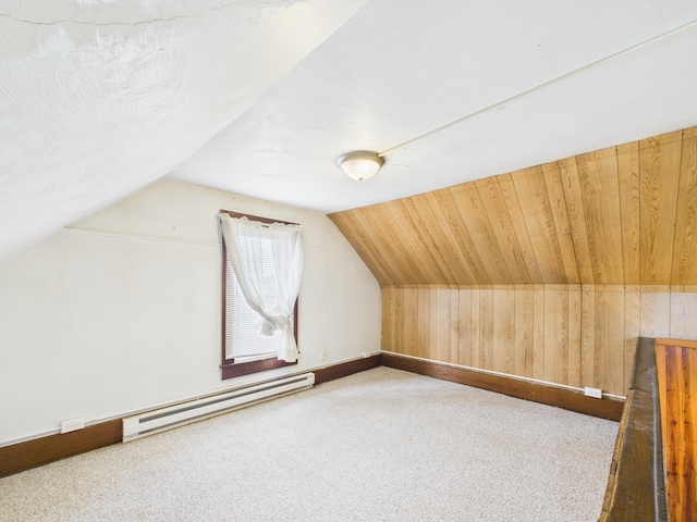 249 W Washington St, New Madison, OH 45346 - additional living space featuring carpet flooring, wood walls, baseboards, baseboard heating, and vaulted ceiling