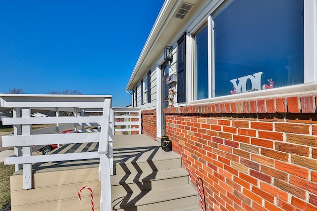 view of home's exterior with brick siding