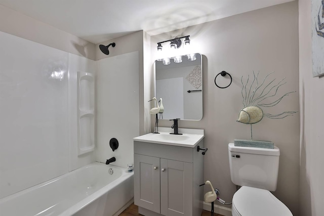 bathroom with vanity, toilet, and shower / bathing tub combination