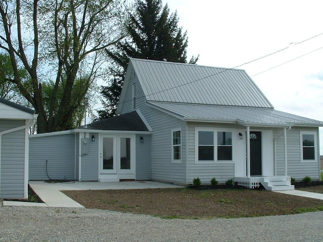 ranch-style home featuring metal roof