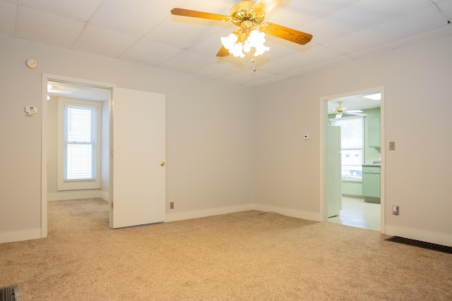 spare room with light colored carpet