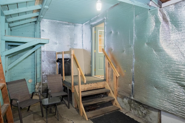 stairs featuring vaulted ceiling