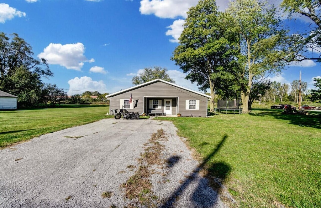 1324 Glenn Ave, Lima, OH 45806 - bungalow-style home with a trampoline and a front yard